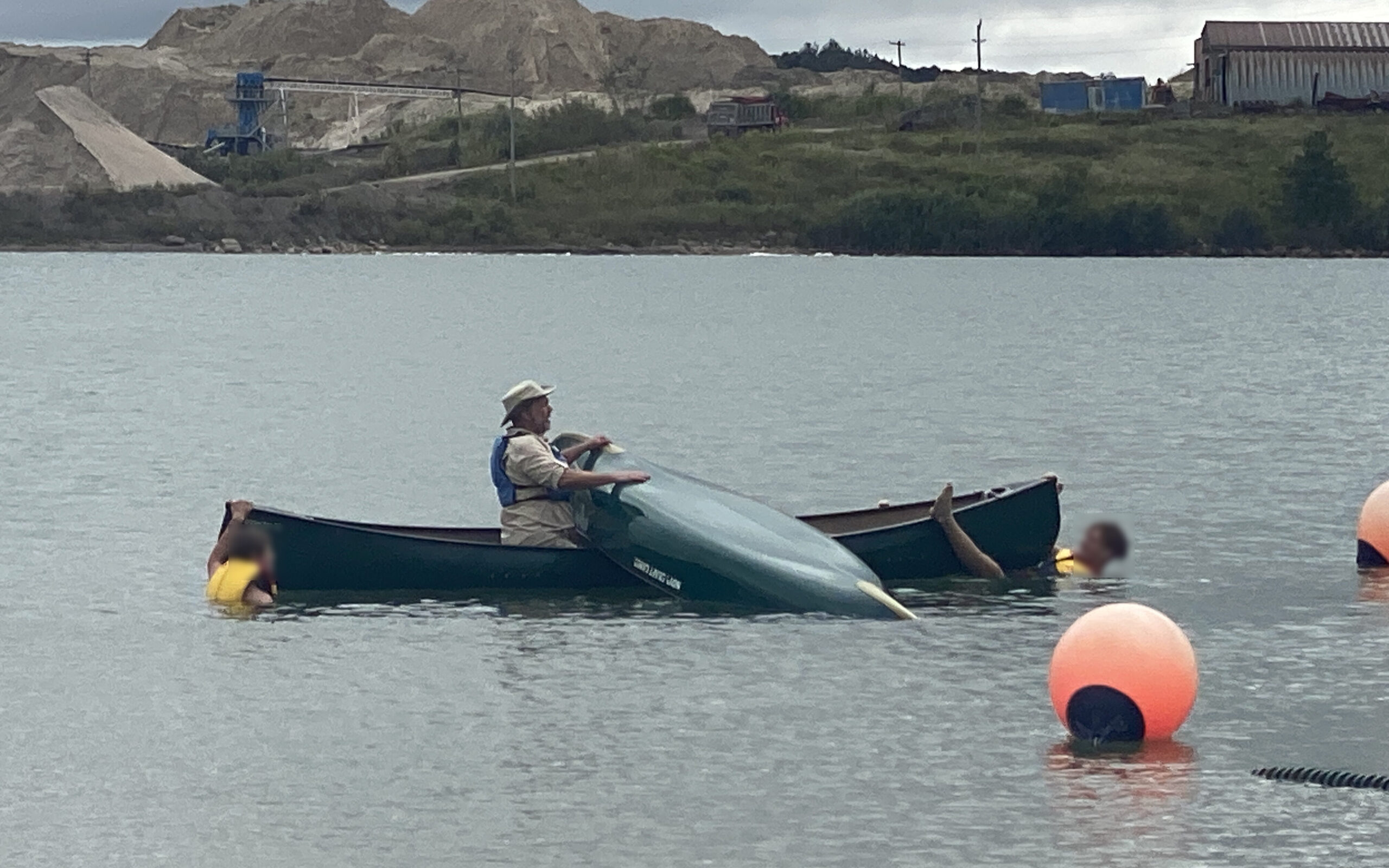 Dan instructing the team how to canoeing