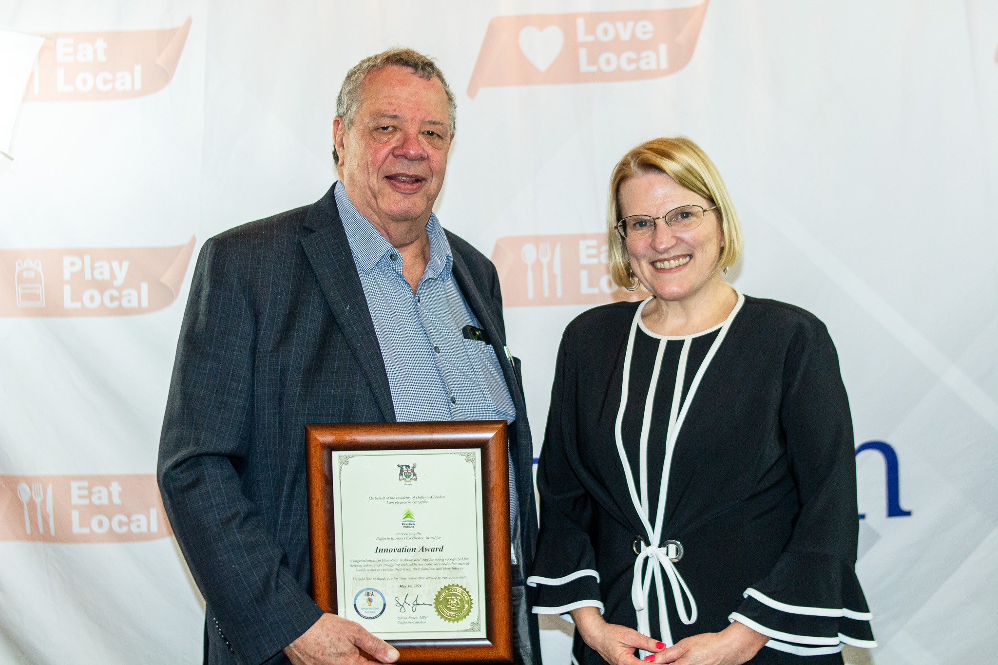 MP Sylvia Jones presented the awards; here with PRI CEO Vaughan Dowie.